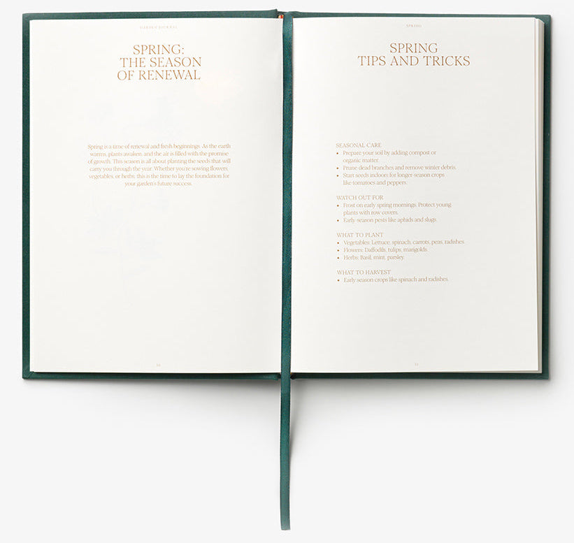 An open Secret Garden Journal by PrintWorks displays “Spring: The Season of Renewal” and “Spring Tips and Tricks,” sharing care advice, with a green ribbon bookmark—ideal inspiration for your gardening planner or garden journal.
