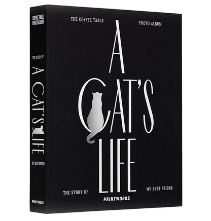 The PrintWorks Photo Album A Cat's Life is a black hardcover pet memory book featuring a cat silhouette on the cover—ideal as a cat photo album or coffee table photo album.