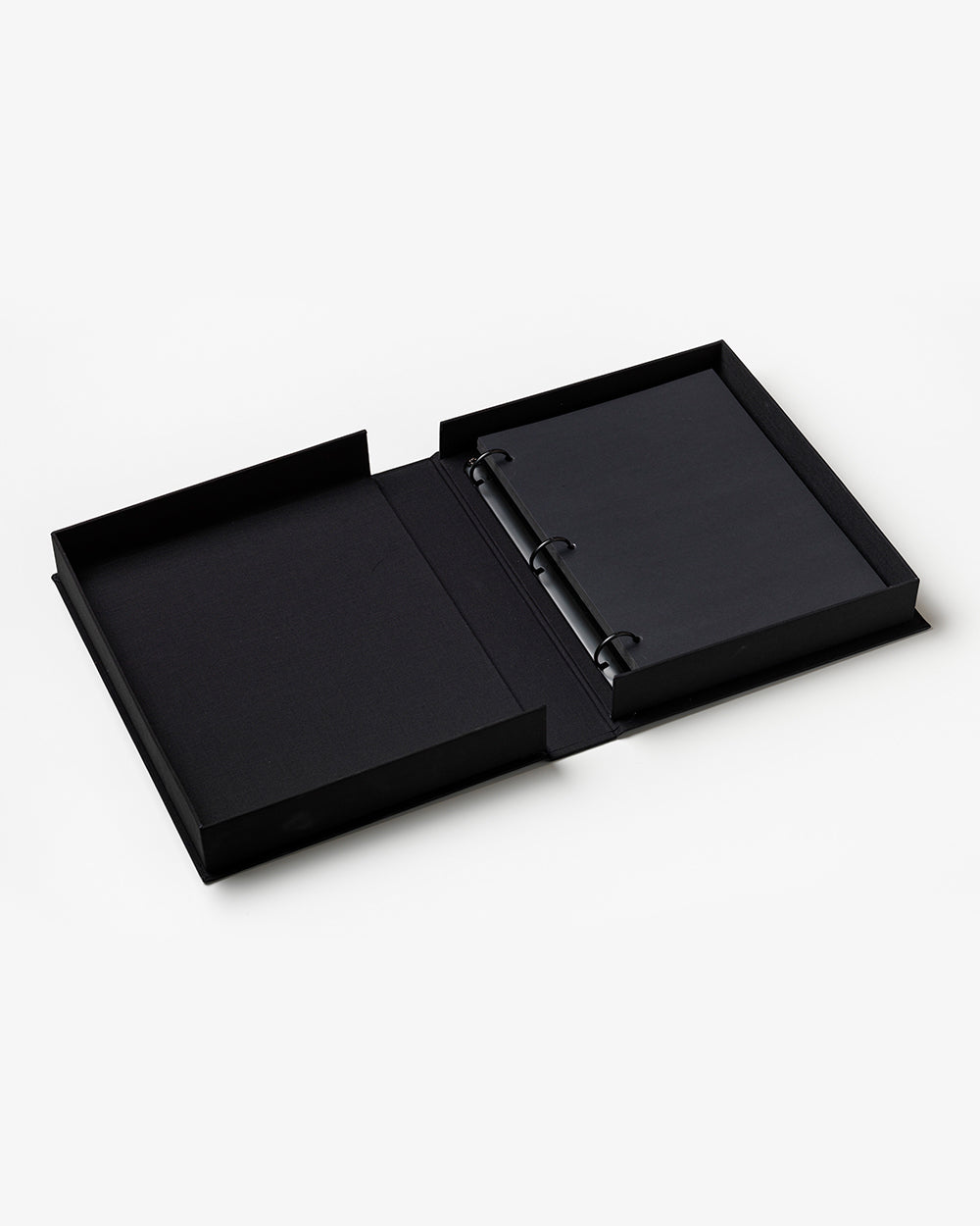 PrintWorks Photo Album A Cat’s Life, an open black three-ring binder with no pages, ideal for creating a custom cat memory book or photo album, shown on a plain white background.