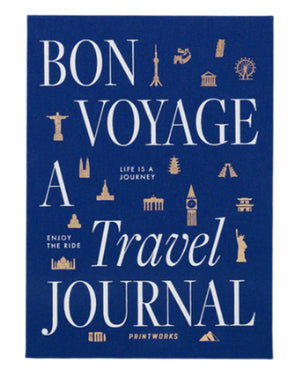 The PrintWorks Bon Voyage Travel Journal features a blue cover with white and gold “Bon Voyage A Travel Journal” text and landmark icons including the Eiffel Tower and Statue of Liberty.