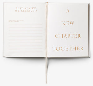 The PrintWorks Our Love Story Wedding Journal features a left page titled "Best Advice We Received" with space to write, and the right page displays "A New Chapter Together" in gold—a perfect keepsake for your special day.