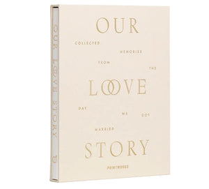 The PrintWorks Our Love Story Wedding Journal features a cream cover with gold lettering, perfect for capturing memories from your wedding day—an ideal keepsake for preserving unforgettable moments.