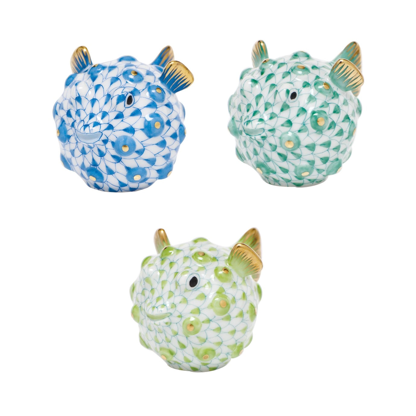 Set of three hand-painted Herend Puffer Fish figurines with gold accents, each in a unique color pattern—blue, teal, and light green—inspired by classic Herend porcelain craftsmanship.