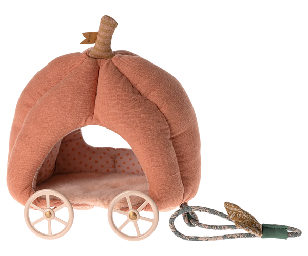 The Maileg Pumpkin Carriage, Mouse, by Maileg is a pink, pumpkin-shaped plush fairytale carriage featuring white wheels and a pull cord. The interior boasts a charming polka dot pattern, making it the perfect toy for kids.