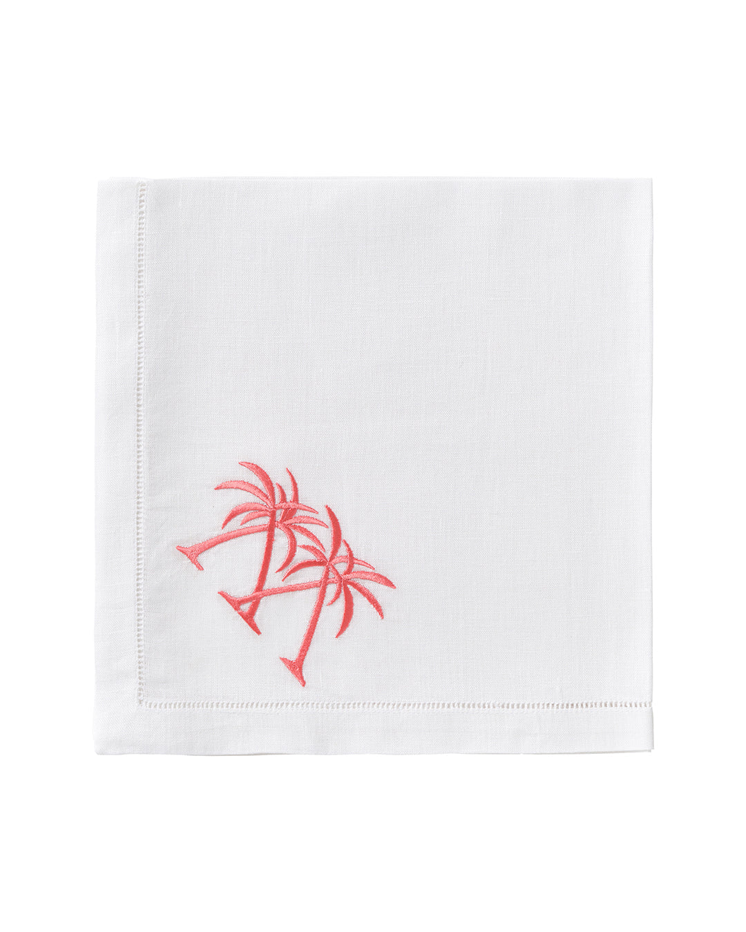 The Pink House Mustique Dinner Napkin Set features white linen napkins with two pink embroidered palm trees—an elegant touch of luxury for your table linens.