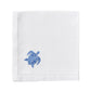 The Pink House Mustique Dinner Napkin Set features white linen napkins with a small blue embroidered sea turtle in one corner, perfect for adding charm to your luxury table linens collection.