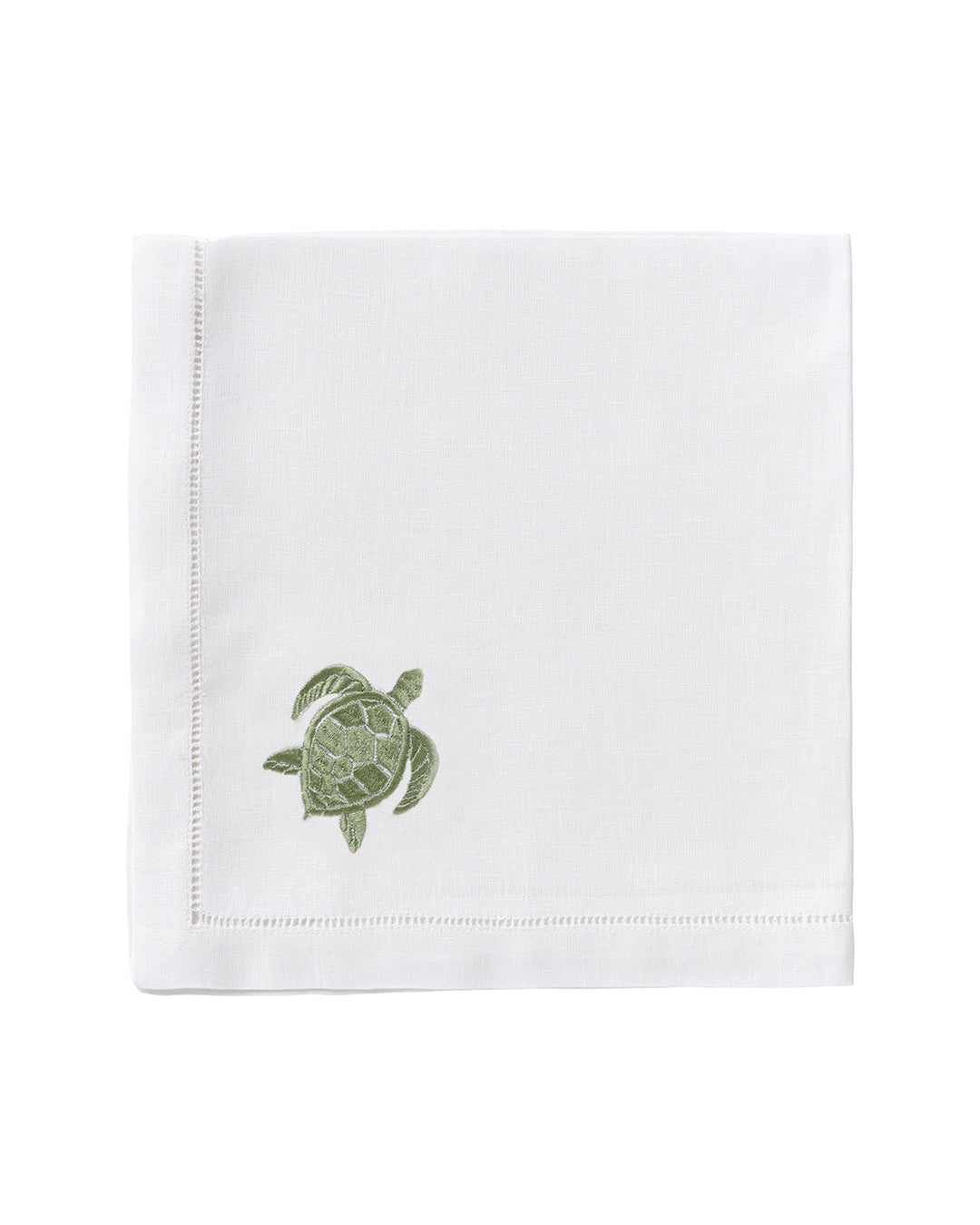 The Dinner Napkin Set by Pink House Mustique features white cloth napkins with a stitched border and a small green embroidered turtle, adding charm to your table—ideal for those seeking luxury or unique embroidered napkins.