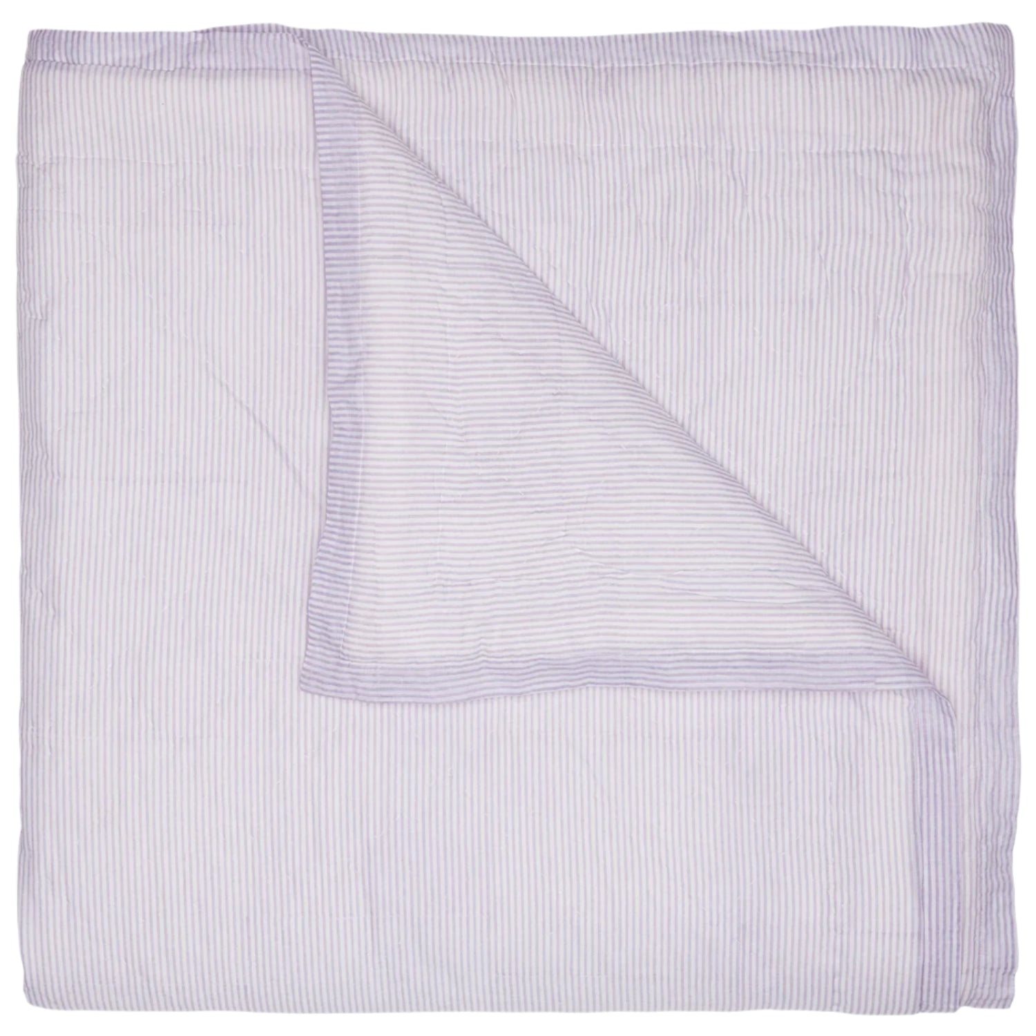 The John Robshaw Nandi Lavender Coverlet features a folded, light lavender hue with subtle vertical stripes, and one corner flipped to reveal its block-printed cotton voile underside.