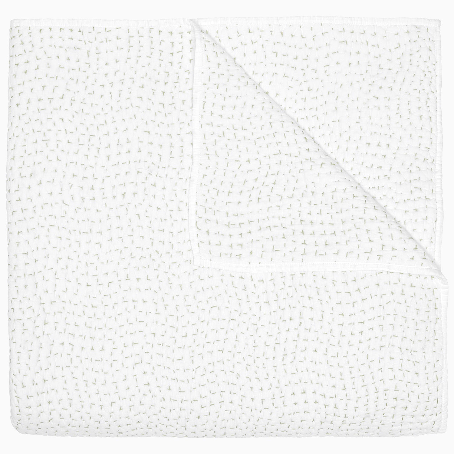 The John Robshaw Hand-Stitched Bedding Collection features a white textured quilt with a prominent stitched pattern, neatly folded to reveal one corner turned over against a plain white background. Crafted from soft cotton voile, this elegant coverlet adds subtle depth and comfort to your bedroom décor.