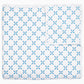 The Layla Bedding Collection by John Robshaw showcases a white cotton voile quilt adorned with a repeating blue geometric pattern of interlocking circles, neatly folded to reveal its reverse side, echoing the intricate motifs inspired by Mughal gardens.