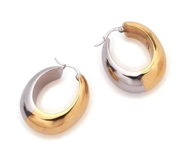 A pair of gold-plated brass hoop earrings by Lizzie Fortunato.