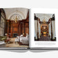 The book "Raffles" by Assouline showcases opulent interiors, featuring ornate wood paneling, a chandelier, elegant furniture with Asian charm including a canopy bed, and draped large windows—evoking the luxurious essence of Raffles hotels.