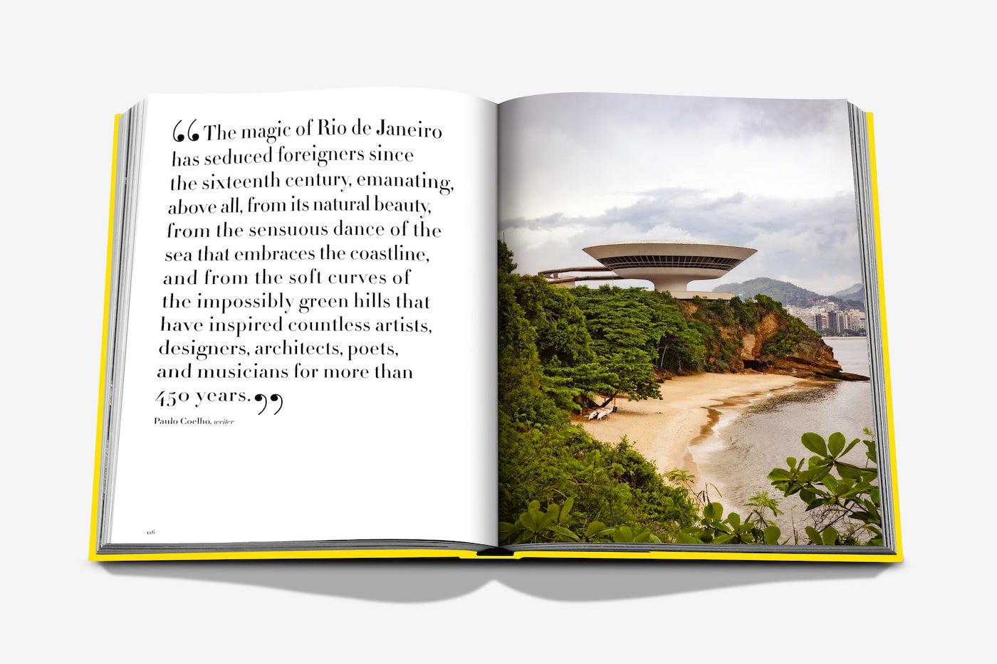The Assouline Rio De Janeiro book shows a quote about the city on the left page and, on the right, an image of Copacabana beach with a modern round building and distant mountains.