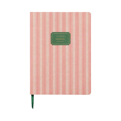 The Rifle Paper Co. Pinking Stripe Softcover Journal features lined pages, pink and white vertical stripes, a green cover label, and a green ribbon bookmark.