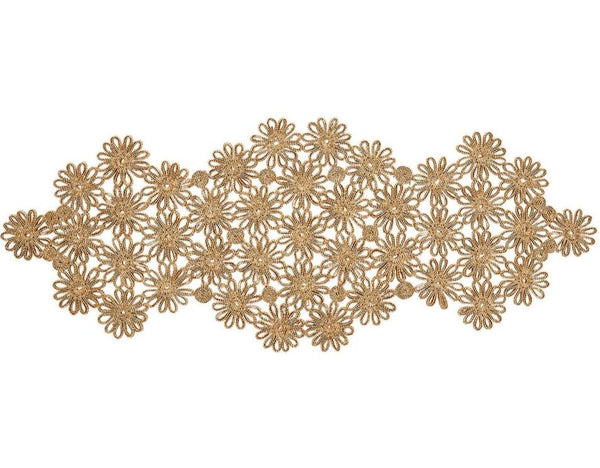 Kim Seybert's Flores Runner features an intricate golden lace design with a floral pattern, showcasing exceptional craftsmanship and natural beauty.