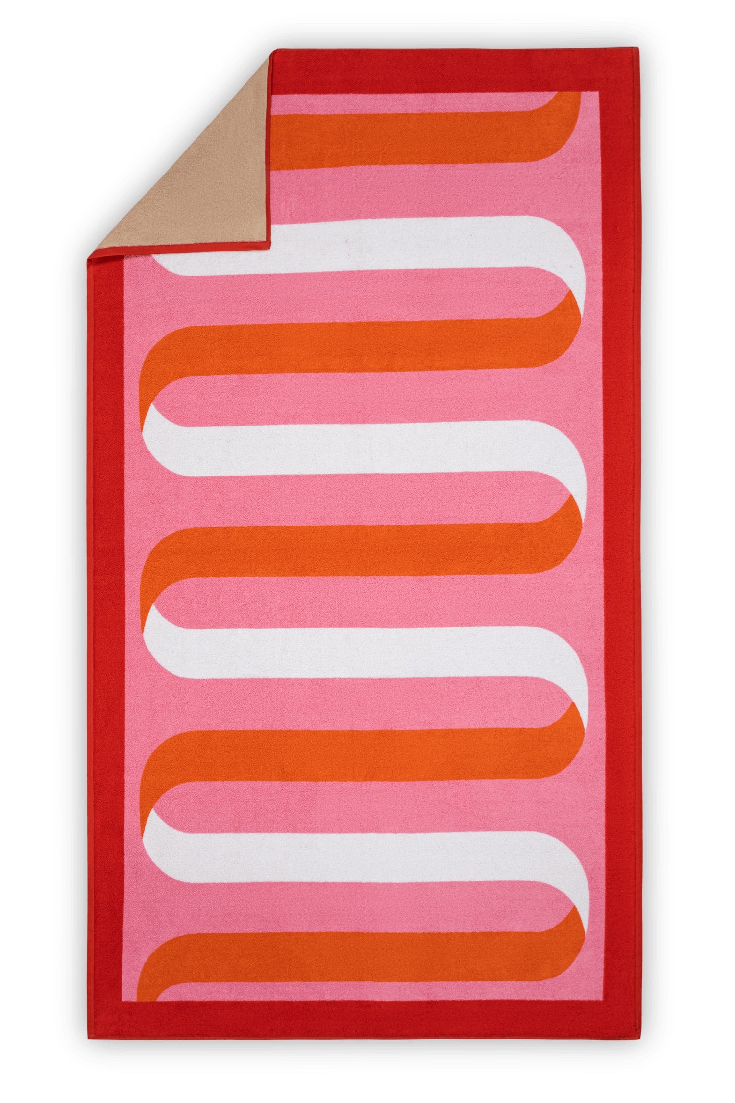 The Matouk Ribbon Beach Towel features a red border, pink background, and wavy orange and white geometric pattern. One corner folds over to reveal its soft tan cotton terry underside.