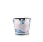The Baobab Collection Riviera Leopolda Candle features blue and pink marbled wax in a glass holder, topped with a black branded lid, inspired by Baobab’s signature glass-making style.