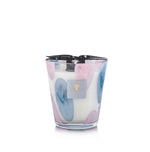 The Baobab Collection Riviera Leopolda Candle by Baobab features blue and pink oval patterns on its holder and is topped with a black ribbon.