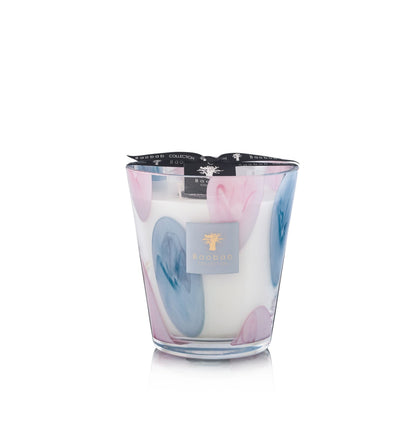 The Baobab Collection Riviera Leopolda Candle by Baobab features blue and pink oval patterns on its holder and is topped with a black ribbon.
