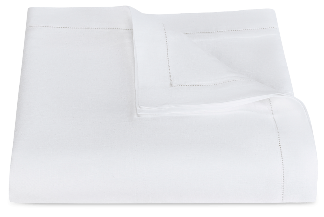 Part of our refined bedding range, the Matouk White Roman Hemstitch Bedding Collection features a folded white sheet with elegant hemstitch detailing on the edges.
