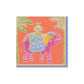 The Caspari Royal Elephant Orange Collection features a vibrant pink elephant with decorative patterns between palm trees on an orange background—perfect for eco-friendly, biodegradable, and compostable napkins.