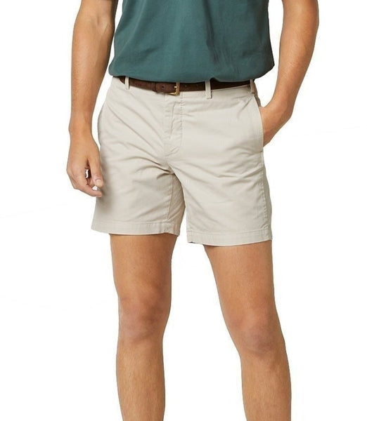 Cropped view of a person wearing Sid Mashburn Garment Dyed Sport Shorts with a 7" inseam and a blue shirt with a brown belt.