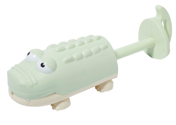 A green plastic fish-shaped Sunnylife Water Squirters with wheels and a handle, isolated on a white background.