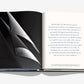 The Assouline "Saint Tropez Yachting" book features a black and white yachting photo on the left page, with sleek text on the right, capturing the elegance of Mediterranean sailing.