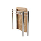 The Sundeck Folding Table by Summit Furniture features a metal frame inspired by campaign furniture, chrome legs, and a perforated rectangular wooden tabletop, shown partially folded.