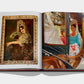An open book, Sevilla Arte by Assouline, reveals a portrait of a woman with a fan evoking flamenco spirit and a photo of two women in traditional attire inside a vehicle, capturing the essence of the culture.