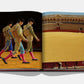 An open Sevilla Arte book by Assouline reveals pages with matadors gracefully on the left and an empty bullfighting ring evocative of flamenco's rhythm on the right.