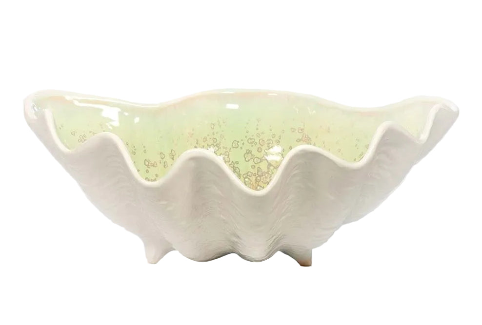 The Medium Clam Bowl Collection by AE Ceramics features a white ceramic bowl with a glossy, light yellowish-green interior and a wavy scalloped rim—an elegant piece of coastal dinnerware.