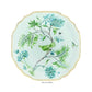 From Aquazzura Casa's Secret Garden Dinnerware and Serveware Collection, this porcelain dessert plate features a green bird, blue flowers, a butterfly, and a bee with gold accents on a light background.