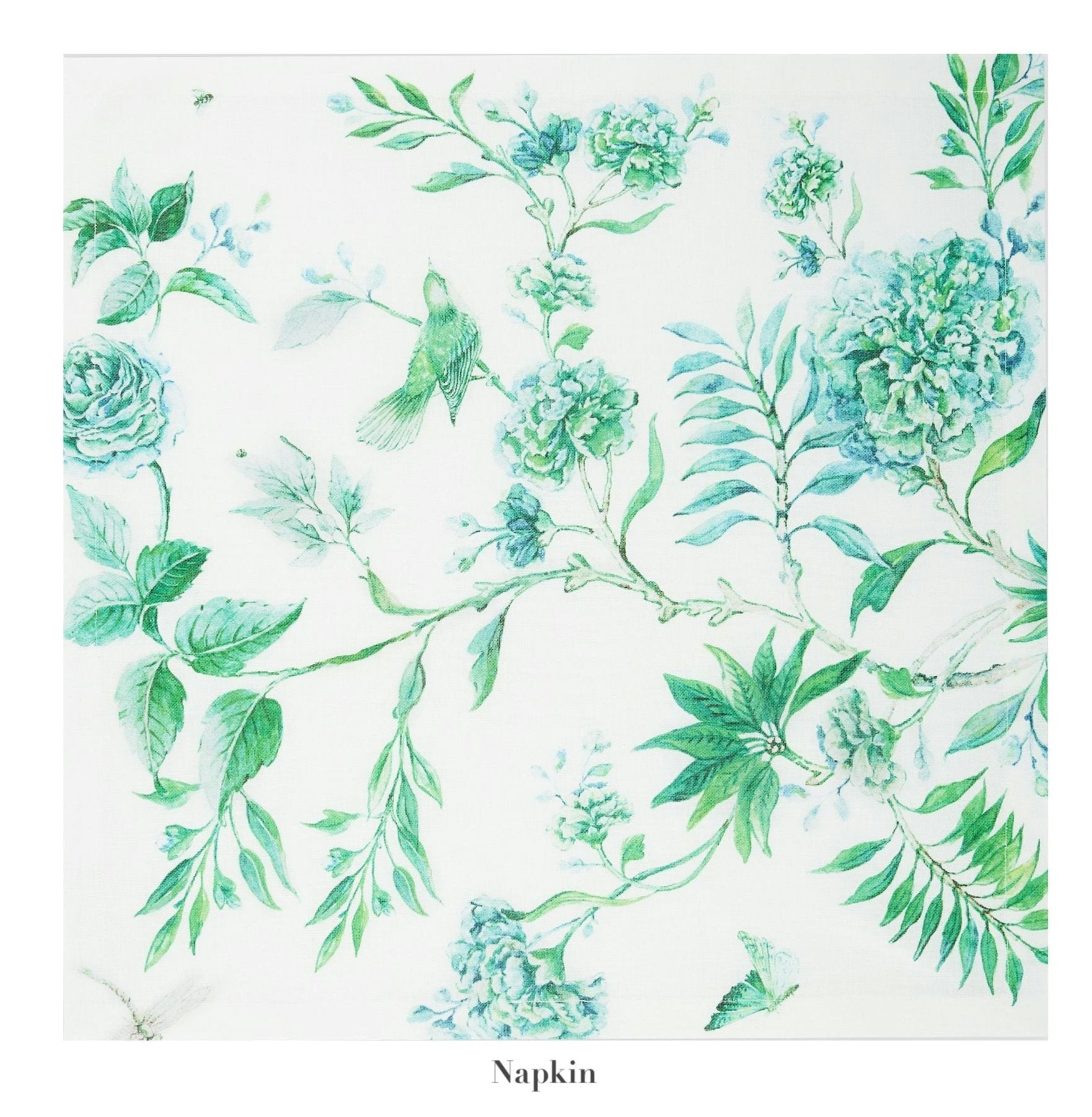 The Secret Garden Table Linen Collection napkin by Aquazzura Casa features a white base with green and blue floral and bird prints, ideal for pairing with matching tablecloths or placemats to create a charming tablescape.