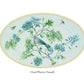 Oval platter from the Aquazzura Secret Garden Collection by Aquazzura Casa adorned with a decorative design featuring a bird, flowers, and insects. This porcelain piece beautifully encapsulates the enchanting garden motif, making it a delightful addition to any table setting or decor.