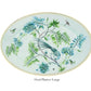 Oval platter from the Aquazzura Secret Garden Collection by Aquazzura Casa, showcasing a decorative design with blue flowers, green leaves, a bird, butterflies, and a dragonfly against a light background.