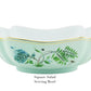 Square porcelain salad serving bowl from Aquazzura Casa's Secret Garden Dinnerware and Serveware Collection, featuring scalloped edges, a light green exterior, golden detailing, and blue-green floral designs.
