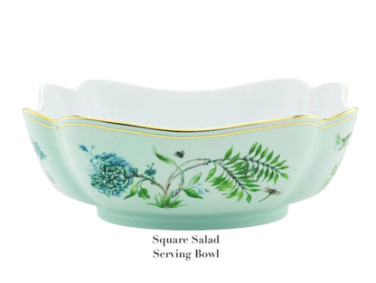 Square porcelain salad serving bowl from Aquazzura Casa's Secret Garden Dinnerware and Serveware Collection, featuring scalloped edges, a light green exterior, golden detailing, and blue-green floral designs.
