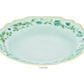 Light blue porcelain soup plate with scalloped edges, gold detailing and rim, green floral motifs, and a butterfly from the Aquazzura Casa Secret Garden Dinnerware and Serveware Collection.