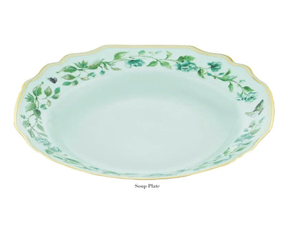 Light blue porcelain soup plate with scalloped edges, gold detailing and rim, green floral motifs, and a butterfly from the Aquazzura Casa Secret Garden Dinnerware and Serveware Collection.