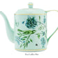 A dainty light blue teapot adorned with gold accents and featuring floral and bird designs inspired by a garden motif is labeled "Tea/Coffee Pot" from the Aquazzura Secret Garden Collection by Aquazzura Casa.