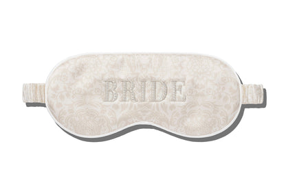 Enjoy a restful night with the Slip Silk Sleep Mask in ivory, adorned with a delicate floral pattern and "BRIDE" beautifully embroidered on the front.