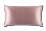 The Slip Silk King Pillowcase, featuring a light pink rectangular design in mulberry silk, is displayed on a white background with a subtle shadow.