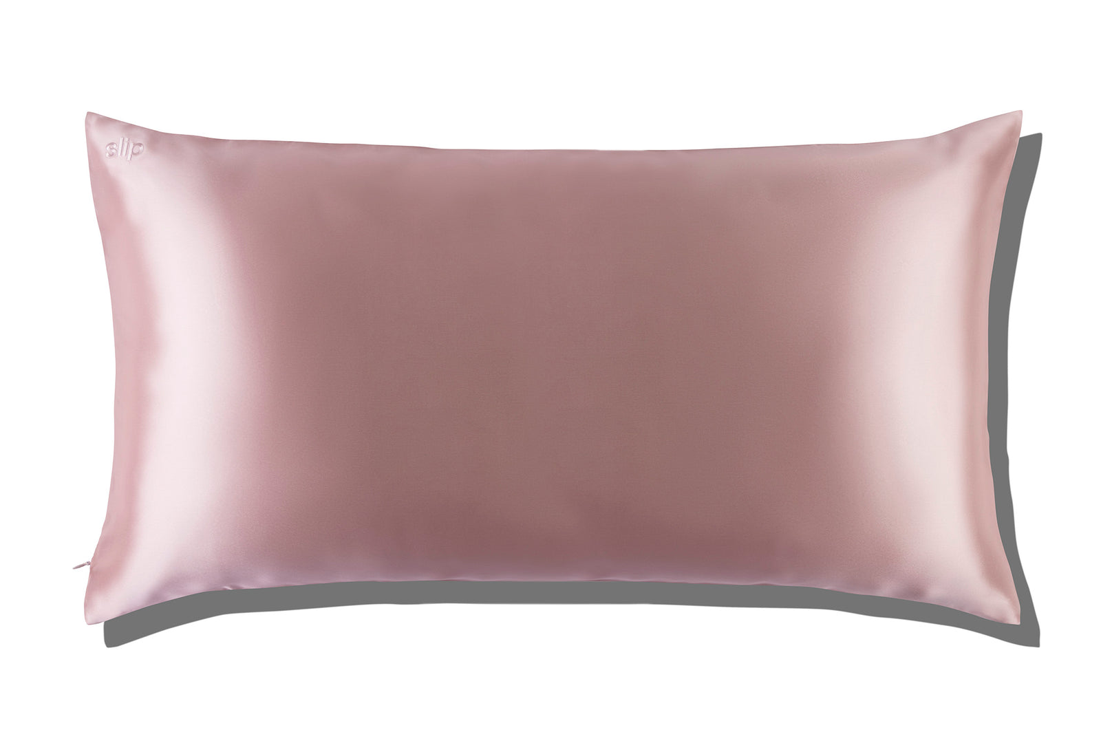 The Slip Silk King Pillowcase, featuring a light pink rectangular design in mulberry silk, is displayed on a white background with a subtle shadow.