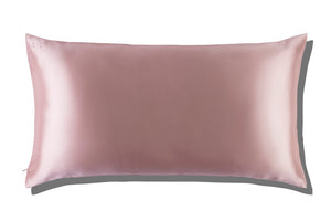 The Slip Silk King Pillowcase, featuring a light pink rectangular design in mulberry silk, is displayed on a white background with a subtle shadow.