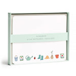 E. Frances Paper Notecard Sets featuring eight watercolor cards and envelopes in a pale green box, illustrated with gardening icons including a watering can, rain boots, and seed packets.