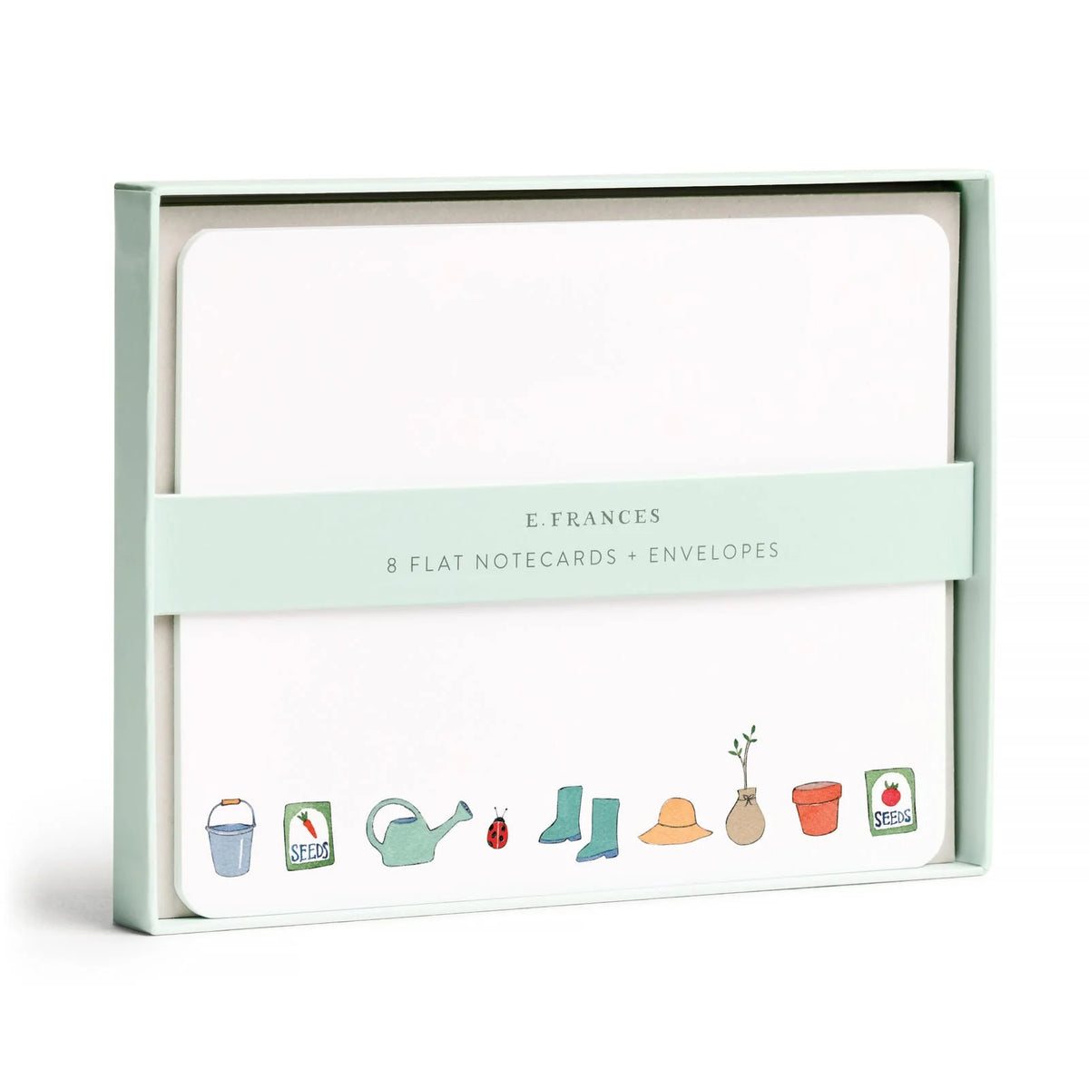 E. Frances Paper Notecard Sets featuring eight watercolor cards and envelopes in a pale green box, illustrated with gardening icons including a watering can, rain boots, and seed packets.