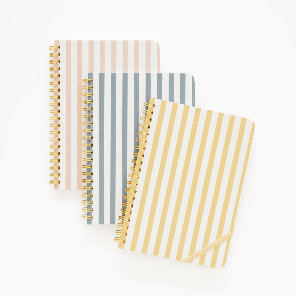 Three Sugar Paper Mini Spiral Notebooks with vertical stripes in pink, gray, and yellow are arranged on a white background. Each notebook features lined pages and a to-do checklist for convenient planning.