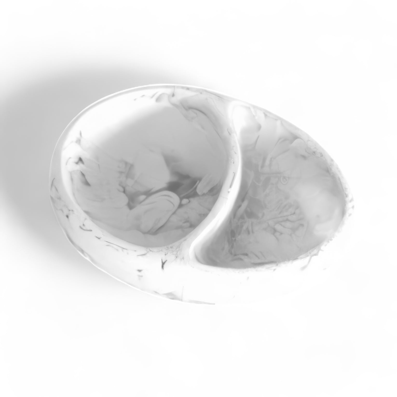 The Nashi Home White Swirl Resin Serveware Collection features a white, oval serveware piece with a marbled pattern and a raised divider creating two sections, displayed on a white background.