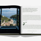 An open book, Splendido: The Radiant Stage of Portofino by Assouline, shows a photo of Portofino seen through a window at the iconic Splendido hotel, with text about the location on the facing page.